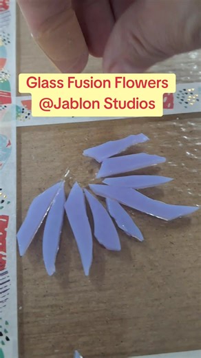 Picture Frame Glass Fusion Flower Project ! So excited to design this ! The background glass was cut to fit the frame. I started creating one of the three 4x6 rectangle area of glass fusion flower scenes. After all 3 are complete,the entire long panel will be put into the Kiln. If I measured right, each of the flower scenes will pop out through the 3 4x6 openings in the picture mat. And will be placed in the white picture frame. #artist #art #glassart #artistsoftiktok #fyp