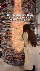 The Infinity Book Tower in Prague 🤍📚 Over 8,000 books stacked into what feels like a never ending tunnel of stories. Standing here made us wonder… if you pulled one book out, would the whole thing fall apart or keep going forever? 📍 Municipal Library of Prague, Czech Republic #prague #praha #czechrepublic #praguelife #beautifuldestinations library booklovers europevibes travelinspo | The Lost Two