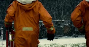 firefighters are holding extinguishing fire together and wide shot safety rescue duty using water first person shoot 4k HD