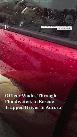 Officer Wades Through Floodwaters to Rescue Trapped Driver in Aurora | N18G