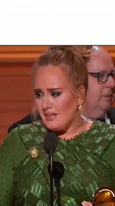 Adele had won the Grammy for “Album of the Year”. But she wasn’t happy. A powerful person was looking at her. People on social media said that she was terrified of beating Beyoncé, and that she didn’t wanna deal with the consequences of “stealing her glory”. | Upbeat
