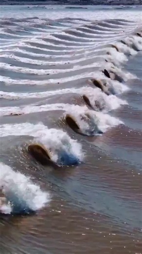 The "Dragon Eye" wave in the Qiantang River, China, is a tidal bore, a natural phenomenon where the incoming tide forms a wave that travels up the river, reversing its current