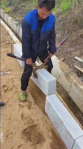 The skills of road workers using curbstone fixtures to transport and install curbstones