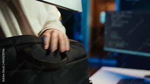 Computer scientist unpacking laptop bag, preparing to design and develop software applications. IT professional starting job shift, opening notebook to do coding, camera B