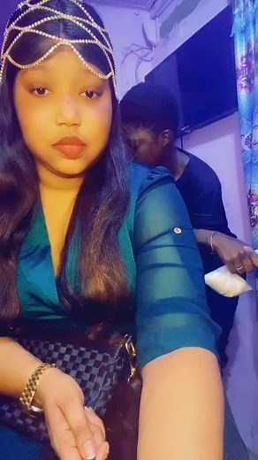 Stylish Indoor Look with Green Top and Checkered Bag