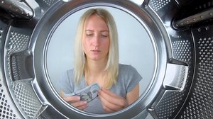 Housewife Counts Money Near Washing Machine Stock Footage Video (100% Royalty-free) 1089802345 | Shutterstock