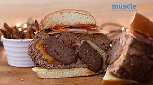 215K views · 935 reactions | O.M.G - Is this the Mother of ALL BURGERS ... How immense does this Gigantic Stuffed Cheese Burger look? Certainly one you'd need to share. | MuscleFood | Facebook