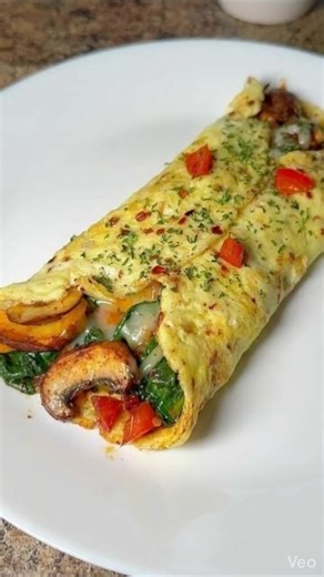 🍳 Loaded Veggie Cheese Omelette A fluffy, protein-packed omelette loaded with colorful veggies and melty cheese — perfect for a hearty breakfast, brunch, or even a quick dinner! 🛒 Ingredients (Serves 1–2) 3 large eggs 2 tablespoons milk (optional, for fluffier texture) ¼ teaspoon salt ¼ teaspoon black pepper 1 tablespoon butter or olive oil Veggie Filling: ¼ cup bell peppers, diced (any color) ¼ cup onions, finely chopped ¼ cup mushrooms, sliced 2 tablespoons spinach, chopped 2 tablespoons tom