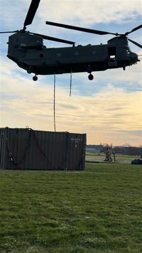 Joint Helicopter Support Sqn | As one CH-47 Chinook holds on the ground, poised for an internal load serial with a quad bike, another works on lifting a flatrack as an... | Instagram