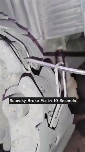 The 1-Minute Garage Fix: Reinstalling a Brake Retaining Spring with a Screwdriver