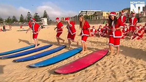 These surfing Santas just set a big world record | NowThis