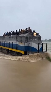 Passenger Train Pushes Massive Wake While Forcing Passage Through Deep, Flood-Submerged Tracks. | Alone Feel