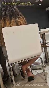 candid shoeplay in foodcourt