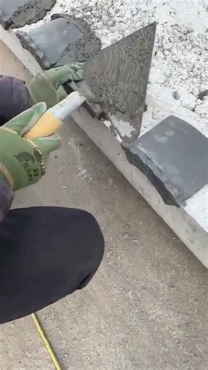 the process of installing roof tiles on cement mortar on the edge of the building roof #construction