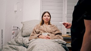 The ENT doctor examines the patient's oral cavity in the office of the polyclinic with professional tools Stock Video