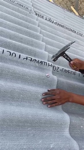 Precision Roofing Technique: Securing Corrugated Sheets 🏠#Roofing #Construction #Building #Handyman