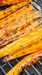 Easy Grilled Carrot recipe - add some seasoning and finish with a delicious citrus glaze. Grilled directly on our Big Green Egg | Vindulge
