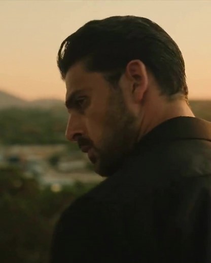 Michele Morrone Captivates in Sunset Landscape