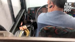 Bus driver caught watching videos behind the wheel