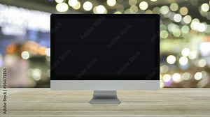 Bank flat icon on desktop modern computer monitor screen on wooden table over blur light and shadow of shopping mall, Business banking online concept