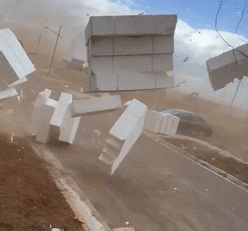 Foam flies as 'crazy' dust storm whips across construction site