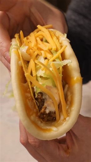 Dollar Tree Dinners on Instagram: "My take on the Taco Bell Cheesy Gordita Crunch I rigged up an at-home version of the steamer that gives so many Taco Bell recipes their unique texture. What you’ll need: • 1 flatbread (I used Mission brand chalupa shells) • Crunchy taco shell • Seasoned taco meat (See Enchirito Video) • Shredded lettuce • Baja sauce (see my previous video) • 3-cheese blend (cheddar, Monterey Jack, mozzarella — or use taco/Mexican blend) How to make it: Warm the flatbread in a d