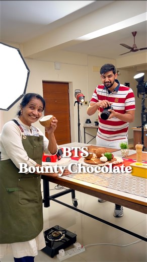 Neeraj Elangovan on Instagram: "BTS of Grandma and I making a Cinematic home made Bounty Chocolate video. Though some of these shots look simple, they are far from that, and editing them is a task by itself. Each video has its own challenges but the excitement of sharing the Bts with all of you keeps me going! The recipe we tried for this reel is to recreate the BOUNTY chocolate at home. We also used the automatic scraper to make coconuts easier, which also happens to be the core ingredient for 