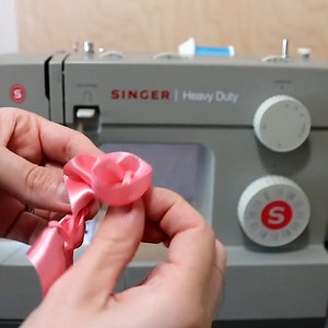 Making a Ribbon Flower from Scraps www.singer.com #singer #sewinglove #easysewing #sewing #diy #singer #sewingaddict #singermiddleeast #Singer_Africa #خياطة #ابداع #تصميم #ماكينات_خياطة #تفصیل | Singer Africa Middle East Ltd.