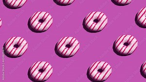 Doughnuts on a background flashing with different colors. Food background, party concept. Glazed donuts geometric pattern.