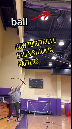 Every #PEteacher has a collection of balls stuck in the ceiling rafters. Here’s how I get them down like an Avenger 😎 NOTE: DO NOT attempt this with students in the gym! The arrows rebound off the ceiling very fast. Also DO NOT ask me how many attempts this took 😅😅😅 #teachersoftiktok #peteachersoftiktok #archerytrickshots #coolteacher #teacherproblems