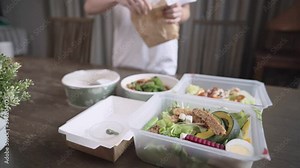 Asian women setting up food table, preparing healthy meals to the table, take away delivery food ordering food online, keep away, house dinner party, lunch box, easy simple home convenience lifestyle