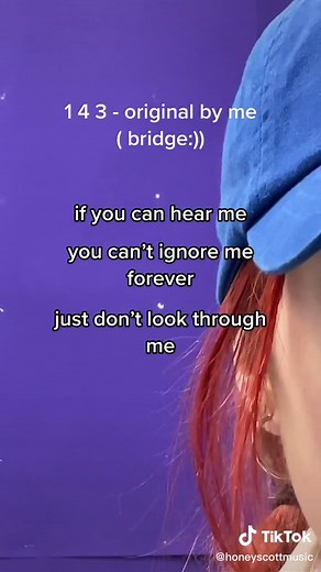 Red-Haired Artist in Blue Cap with Symbolic Lyrics