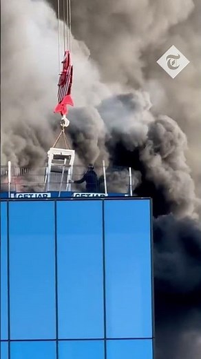 Skyscraper engulfed in flames and plumes of smoke in Reading