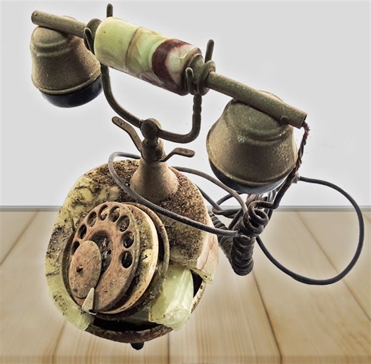 Restoring Telephone with a Rotary Dial The telephone was produced by onix telmar in the 1970s. It was characterized by an external structure in onyx and a style that recalled the first telephones with dialing numbers with a rotary dial. The phone has been found in the attic, where it remained for more than forty years. The stone was broken in several places, and the wires disconnected. At first glance, it might seem like an impossible restoration, which could never bring the phone to its splendo