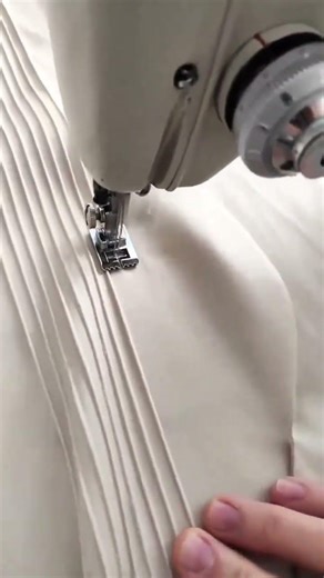 Creating Elegant Parallel Pin Tucks on Beige Fabric with a Precision Sewing Machine