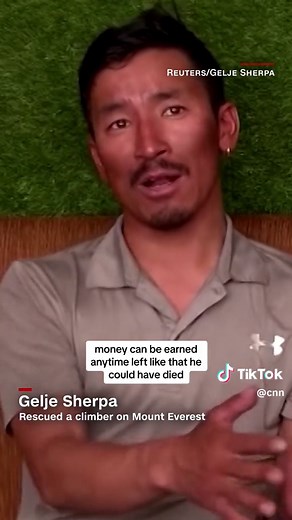 A climber on Mount Everest is home alive and safe after being found clinging to a rope and almost freezing to death near the mountain's summit. A sherpa stopped his ascent up the world's tallest mountain and carried the climber down to safety. #cnn #news #sherpa #nepal #everest #mounteverest #rescue #freezing #summit