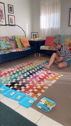 Emma Jean Jansen on Instagram: "Most of what I do with quilting isn’t fast — it’s slow and thoughtful. I feel so lucky to be able to crawl around on the floor, and my plan is to keep doing it for as long as I can. Although one day I would love to have a large enough design wall……… I do try to find small ways to make the process easier though. When I’m packing up my blocks ready for sewing, I stack them on paper plates (I’ve been using the same set for years). I also use laminated row tags — agai