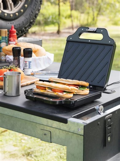 Got a 12V setup and thinking of updating your camp kitchen? We've got you covered! ⚡🍳 The 12V Kitchen Appliance range at Snowys has everything you need to cook like a pro without the gas! From pod coffee machines and kettles to jaffle makers and air fryers – power your culinary adventures straight from your dual battery system. No more lugging heavy gas cylinders or running out of fuel mid-trip. Just plug in, power up, and enjoy delicious meals wherever the road takes you! Explore the full rang