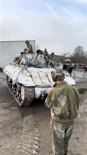 M10 Wolverine in Winter Camouflage While Parking