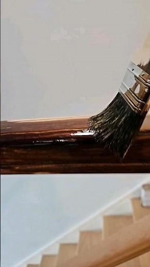 applying stain on handrail
