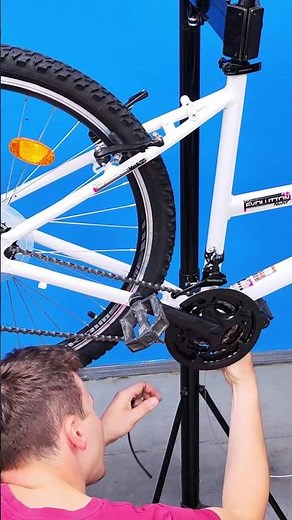 Bicycle assembly: installing the wheel, cable housings, brake cables, and gear shift cables.