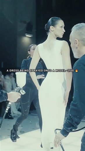 Watching a dress being sprayed on live 💥👀 #fashion #runway #model #bellahadid