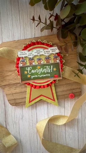 Eileen on Instagram: "Sharing a light-up congratulations rosette card created to celebrate a special milestone in my son’s life. The adorable stamp set is from @lawnfawn, paired with @chibitronics conductive fabric tape and LED stickers to add an interactive glow to this graduation-themed card. The Chibitronics battery template helped keep everything neat and compact—perfect for dimensional cards with hidden tech inside. A joyful way to mark big moments with a little sparkle and light. #LightUpC