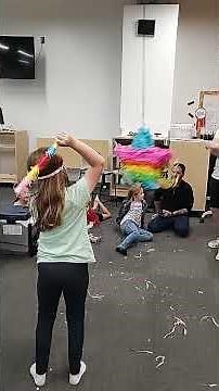 Sophia hitting a pinata at a Birthday party!