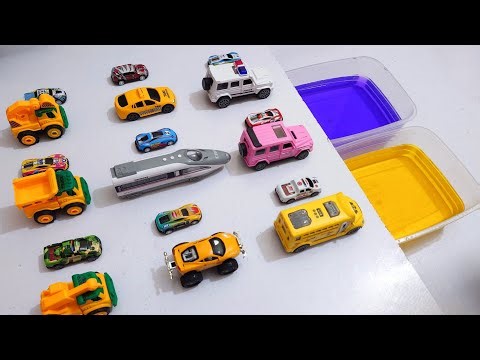 Various Diecast Model Cars Sliding Into The Yellow And Blue Water