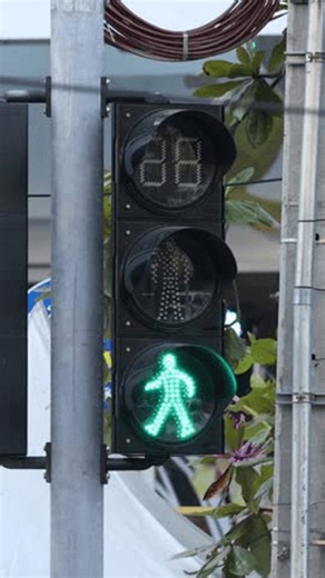 clip-3750360509-traffic-light-changes-walk-stop-signal