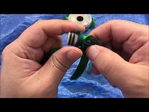 Fixing my broken expandable garden hose again by cutting it short and reattaching to handle end.