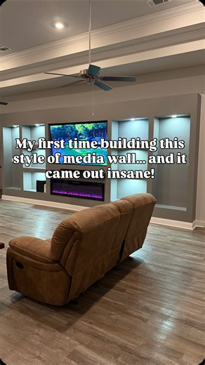 This was my first time building a media wall with this specific layout, niche areas for vase/large plant, three custom shelving areas on each side, a floating mantle, a 72” electric fireplace, and an 85” TV with a full soundbar system. The process took time, precision, and a lot of sanding and painting, but seeing it come together made every detail worth it. 👊 If you’ve ever imagined turning your living room into a modern media space like this, this is your sign to make it happen. 🎨 Steps show