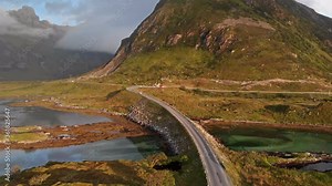 The Fredvang Bridges, Fredvangbruene, are two cantilever bridges at dusk in Lofoten, Norway.