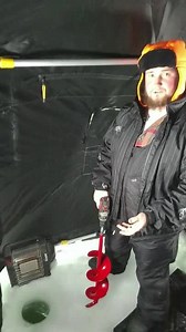 Ice Auger Falls Into Frozen Lake While Guy Tries to Drill Hole in Ice